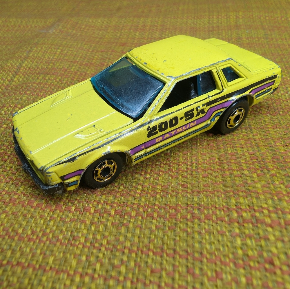 Yellow Datsun Toy Car